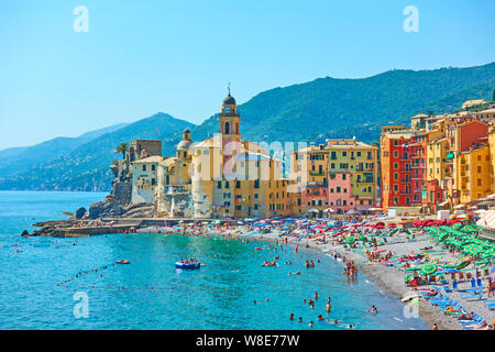 Camogli, Genoa, Italy - July 1, 2019:  Beach and waterfront in Camogli town near Genoa on sunny summer day, Liguria Stock Photo