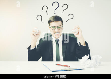 caucasian business man stress and crumpled paper Stock Photo