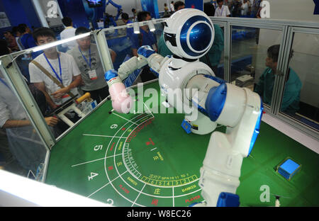 A casino dealer robot is on display during the 14th China