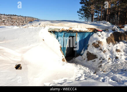 View of the snow-covered cellar of 58-year-old Chinese man Yu Fazhong, where he has been living alone for ten years, near Beiji Village (Arctic Villag Stock Photo