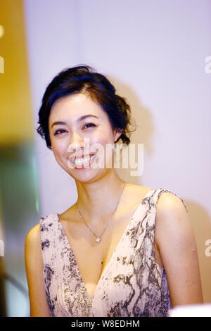 --FILE--Japanese actress Kazue Fukiishi reacts at a press conference for the opening of the Japanese Film Week during the 14th Shanghai International Stock Photo