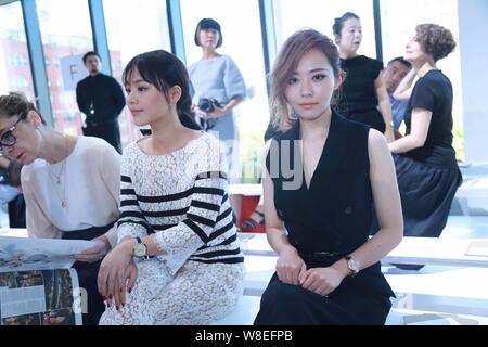 Chinese singer Zhang Liangying, right, and actress Sandra Ma Sichun, center, attend the Michael Kors fashion show during the New York Fashion Week Spr Stock Photo