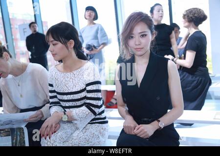 Chinese singer Zhang Liangying, right, and actress Sandra Ma Sichun, center, attend the Michael Kors fashion show during the New York Fashion Week Spr Stock Photo