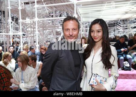 Hong Kong model and actress Angelababy, right, poses at the Christian Dior fashion show during the Paris Haute Couture Fashion Week Spring/Summer 2015 Stock Photo