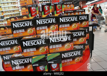 --FILE--Cartons of Nescafe instant coffee of Nestle are for sale at a supermarket in Xuchang city, central Chinas Henan province, 29 June 2014.     To Stock Photo