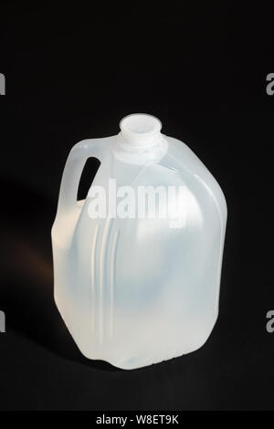 Blank packaging white plastic gallon isolated on black background. Stock Photo