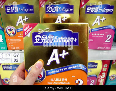 --FILE--A Chinese customer shops for a carton of Enfagrow milk powder of Mead Johnson Nutrition at a supermarket in Changzhou city, east China's Jiang Stock Photo