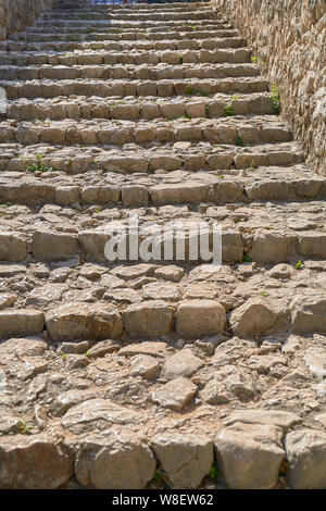 Stairs made of stones in a medieval city Stock Photo