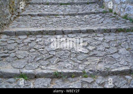 Stairs made of stones in a medieval city Stock Photo