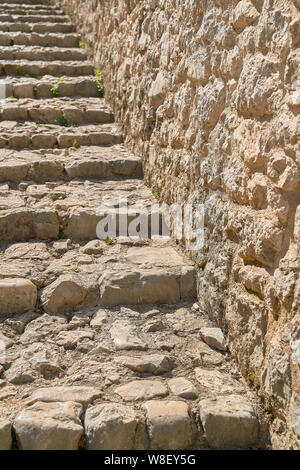 Stairs made of stones in a medieval city Stock Photo