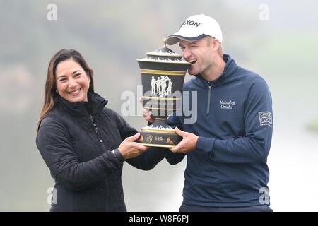 Scottish golfer Russell Knox, right, poses with his champion trophy after winning the 2015 WGC-HSBC Champions golf tournament in Shanghai, China, 8 No Stock Photo