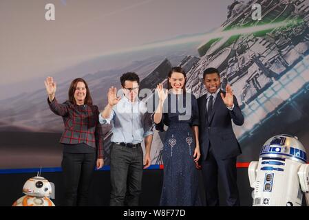 (From second left) American director J. J. Abrams, English actress Daisy Ridley and actor John Boyega wave during a press conference for their movie ' Stock Photo