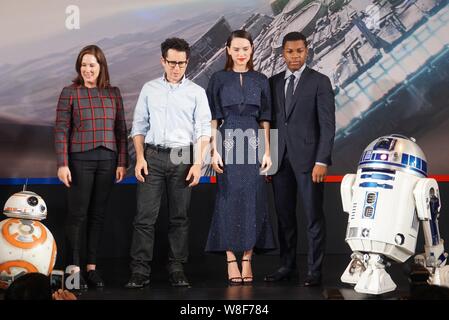 (From second left) American director J. J. Abrams, English actress Daisy Ridley and actor John Boyega pose during a press conference for their movie ' Stock Photo