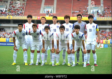 Players of the starting line-up of South Korea pose for photos before a soccer match against North Korea during their soccer match of the Men's East A Stock Photo