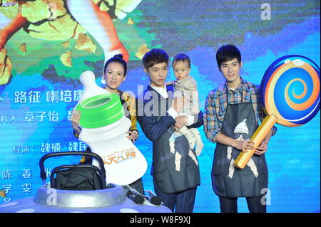 (From left) Chinese actress Zhang Ziyi as a producer, actors Zhang Yixing and Chen Xuedong pose with a little baby at a press conference for their new Stock Photo