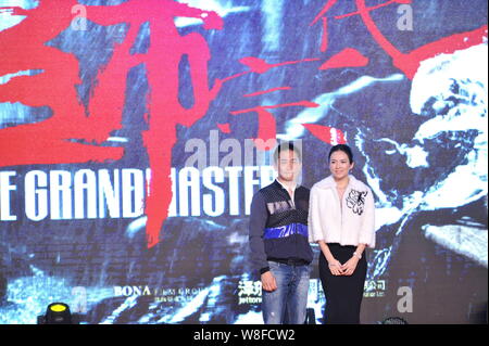 Chinese actress Zhang Ziyi, right, and Hong Kong actor Tony Leung pose at the press conference for the premiere of their movie 'The Grandmaster 3D' in Stock Photo