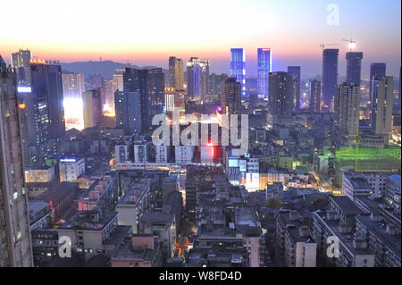 Night view of high-rise buildings in Furong Square CBD in Changsha city, central China's Hunan province, 29 November 2013. Stock Photo