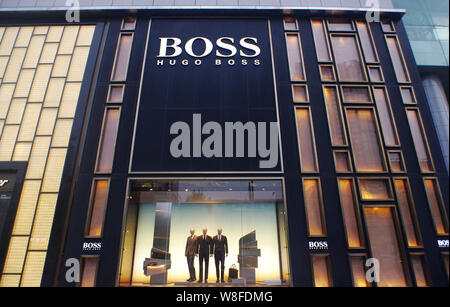 --FILE--View of a Hugo Boss store in Wuhan city, central China's Hubei province, 8 September 2014.   Nearly 30 per cent of the products carrying brand Stock Photo