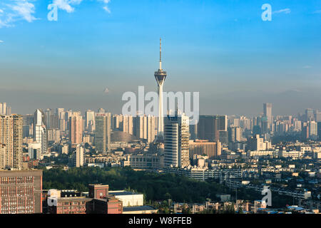 Chengdu, Sichuan Province, China - July 25, 2019: Sichuan TV tower and skyline at morning with the highest peak of Mount Siguniang background. Stock Photo