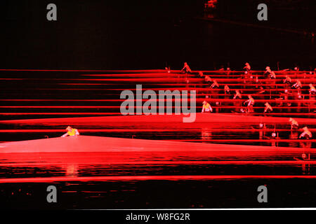 Chinese entertainers perform during a show of the large outdoor performance 'Impression Sanjie Liu' on Li River in Yangshuo county, Guilin city, south Stock Photo