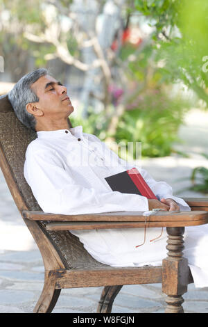 elderly man sleeping in armchair Stock Photo - Alamy