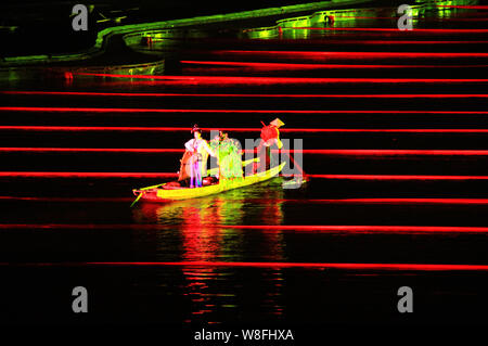 Chinese entertainers perform during a show of the large outdoor performance 'Impression Sanjie Liu' on Li River in Yangshuo county, Guilin city, south Stock Photo