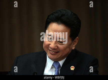 --FILE--Li Xiaopeng, governor of Shanxi province, the son of former premier Li Peng, smiles during a plenary discussion of the Second Session of the 1 Stock Photo