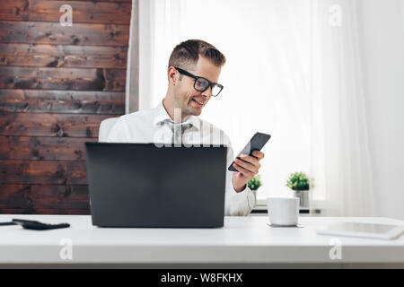 Successful handsome businessman working in his office Stock Photo