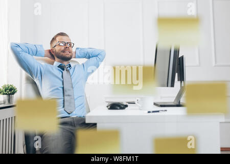 Successful handsome businessman working in his office Stock Photo