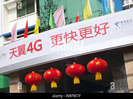 --FILE--View of a branch of China Telecom with an advertisement for the Tianyi Surfing 4G LTE of China Telecom in Yichang city, central Chinas Hubei p Stock Photo