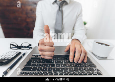 Successful handsome businessman working in his office Stock Photo