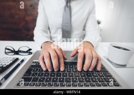 Successful handsome businessman working in his office Stock Photo