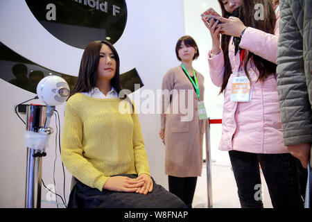 Humanoid robot Geminoid F, produced by renowned robot designer Hiroshi Ishiguro of Osaka University, is on display during the 2015 World Robot Confere Stock Photo