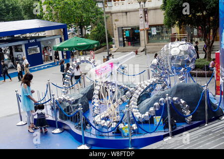 A giant fish made out of cooking utensils is on display during a  promotional event by German cookware maker Fissler at Jiuguang City Plaza  in Shanghai Stock Photo - Alamy