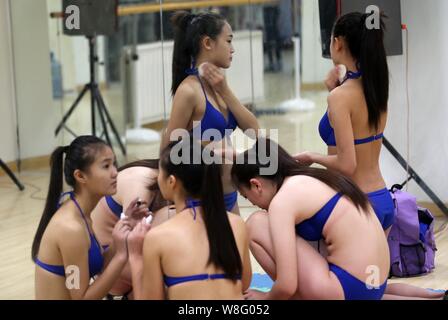 Bikini-dressed female high school students adjust bras during a model  training session at a training center in Weifang city, east Chinas Shandong  prov Stock Photo - Alamy
