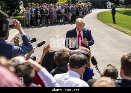 Washington, DC, USA. 9th Aug, 2019. U.S. President Donald J.Trump speaks to the press on the South Lawn of the White House prior to departure on Marine One in Washington, DC on August 9, 2019. Trump is traveling New York for fundraisers before spending a week in Bedminster, New Jersey. Credit: Ken Cedeno/ZUMA Wire/Alamy Live News Stock Photo