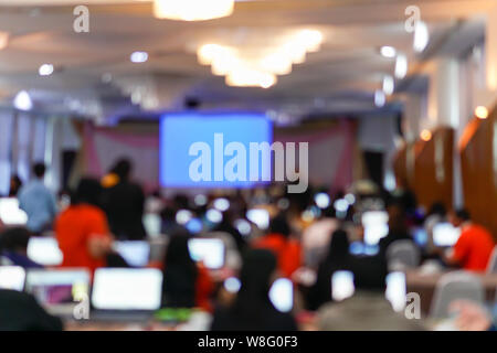 Blurry image in conference room. Abstract blurred people lecture and discussion in seminar room or conference room. Stock Photo