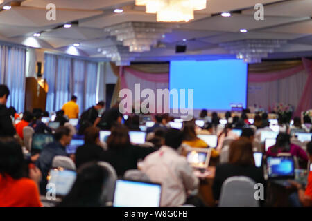 Blurry image in conference room. Abstract blurred people lecture and discussion in seminar room or conference room. Stock Photo