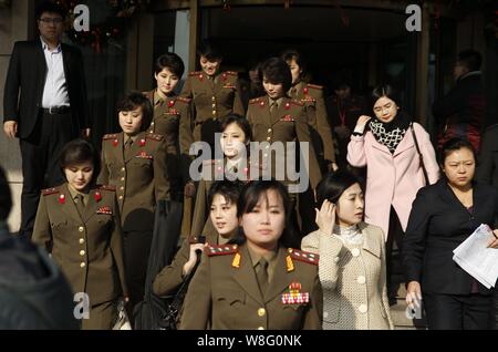 Members of North Korean pop group Moranbong Band leave a hotel for a rehearsal in Beijing, China, 11 December 2015.   Moranbong Band is the latest (an Stock Photo