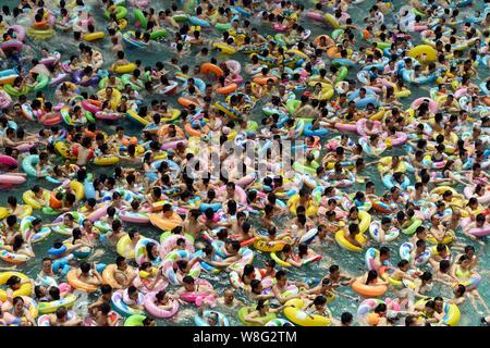 Holidaymakers crowd a swimming pool, also known as 'China's Dead Sea' on a scorching day in Daying county, Suining city, southwest China's Sichuan pro Stock Photo