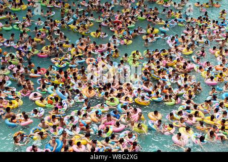 Holidaymakers crowd a swimming pool, also known as 'China's Dead Sea' on a scorching day in Daying county, Suining city, southwest China's Sichuan pro Stock Photo