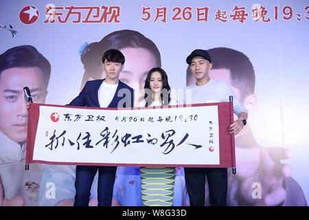 (From left) Chinese actor Li Dongxue, Chinese actress Zheng Shuang and Hong Kong actor Hawick Lau pose during a press conference for their TV series ' Stock Photo