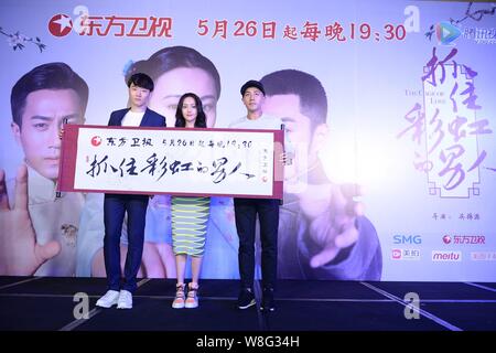 (From left) Chinese actor Li Dongxue, Chinese actress Zheng Shuang and Hong Kong actor Hawick Lau pose during a press conference for their TV series ' Stock Photo