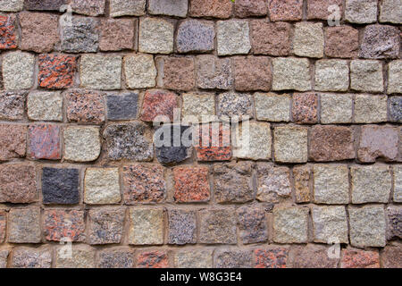 Building stone red gray, paving stones, natural building material for walls and roads Stock Photo