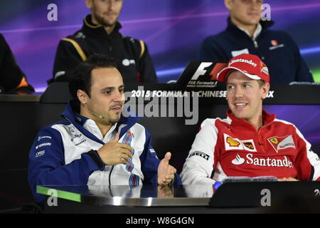 Brazilian F1 driver Felipe Massa of Williams, left, and German F1 driver Sebastian Vettel of Ferrari attend a press conference for the 2015 Formula 1 Stock Photo