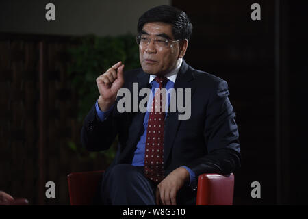 Fu Chengyu, Chairman of China Petroleum and Chemical Corp (Sinopec), speaks at an interview during the Third Session of the 12th National Committee of Stock Photo