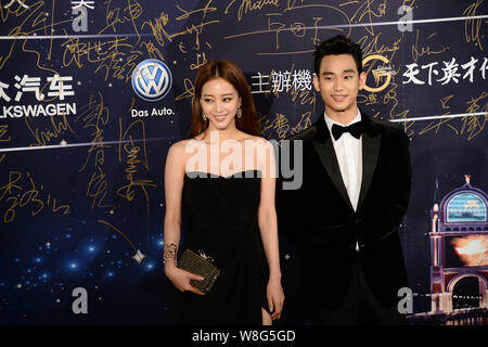 South Korean actress Han Ye-seul, left, and actor Kim Soo-hyun pose on the red carpet as they arrive for the 15th Huading Award Global Performance Cel Stock Photo