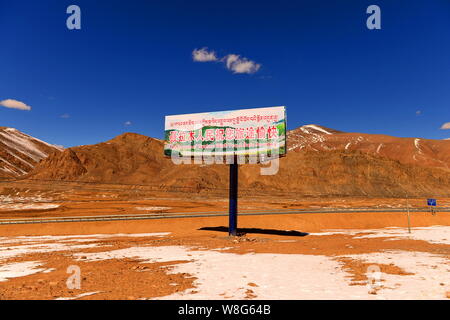 --FILE--Landscape of the China National Highway 318 with a welcome billboard on the roadside in Nyalam county, Shigatse, southwest China's Tibet Auton Stock Photo