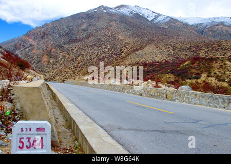 --FILE--Landscape of the China National Highway 318 through mountains in Zhangmu town, Nyalam county, Shigatse, southwest China's Tibet Autonomous Reg Stock Photo