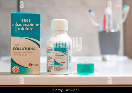 Carrara, Italy - August 9, 2019 - Bottle of Oki inflammation and pain mouthwash for the treatment of pain in the oral cavity due to gingivitis, perido Stock Photo